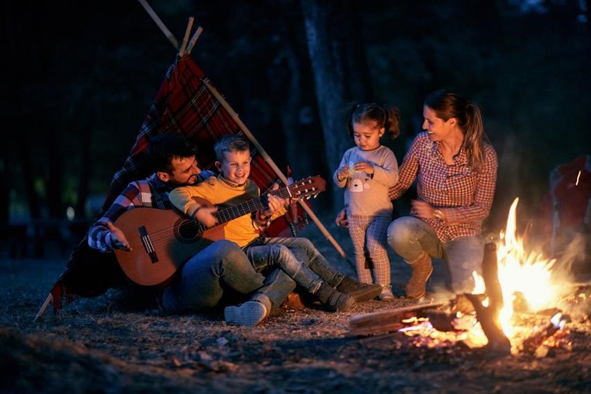 A family camping outdoors