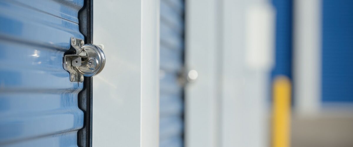 A blue storage unit with a round disc lock.
