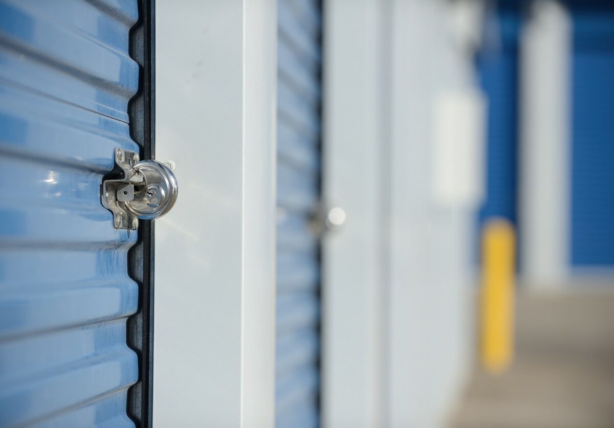 A blue storage unit with a round disc lock.