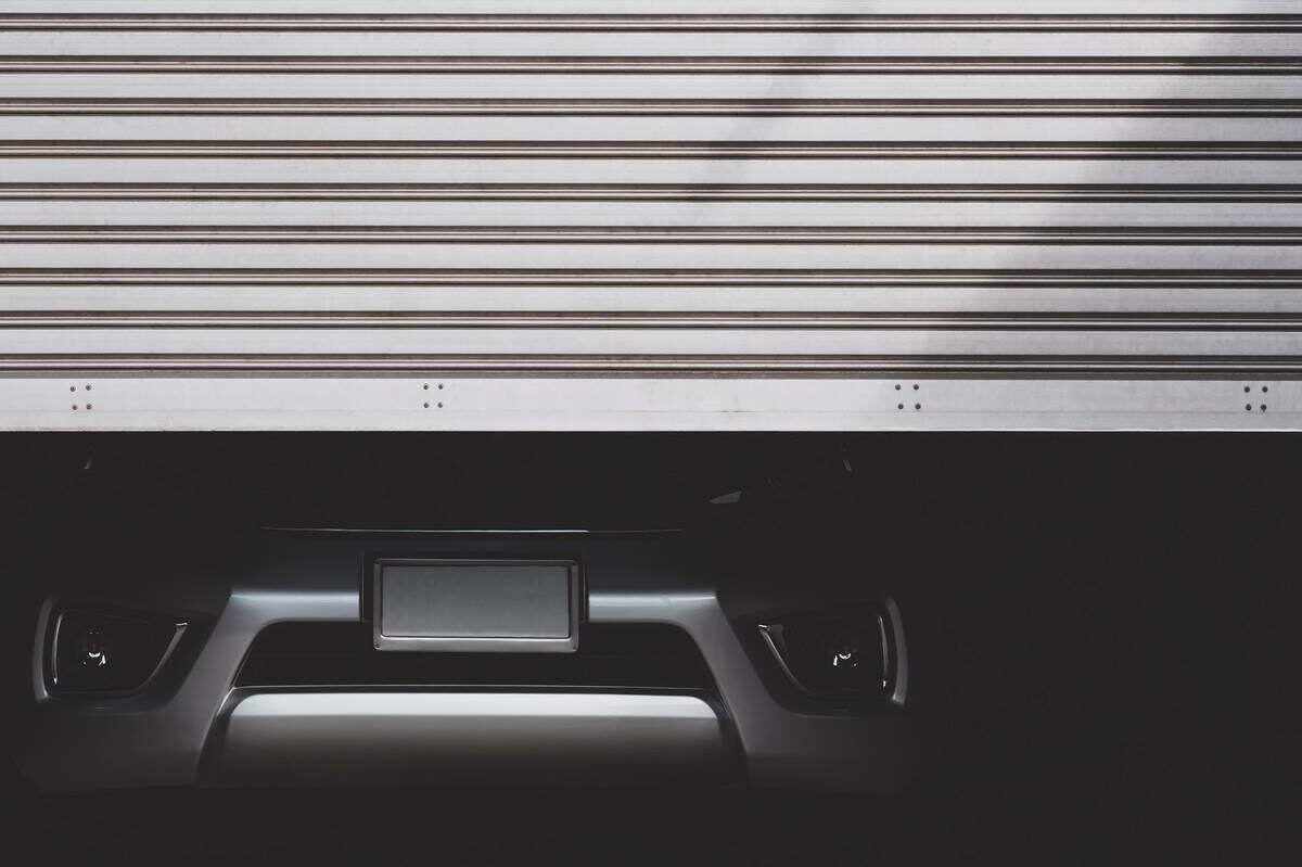 A car behind an indoor storage unit door