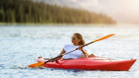 A woman kayaking on the lake