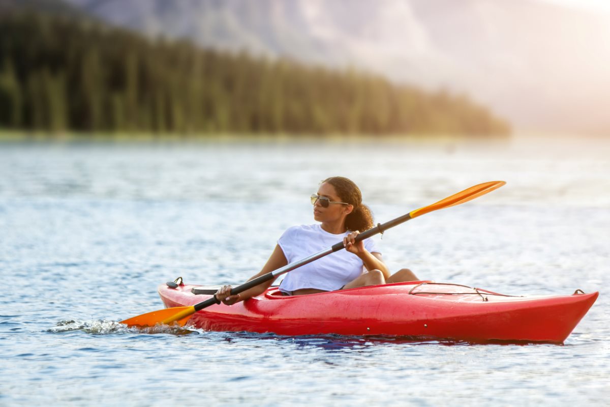 A woman kayaking on the lake