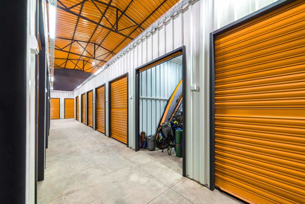 Corridor of self storage unit with orange doors