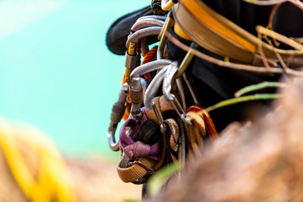 A close-up view of carabiners and climbing gear.