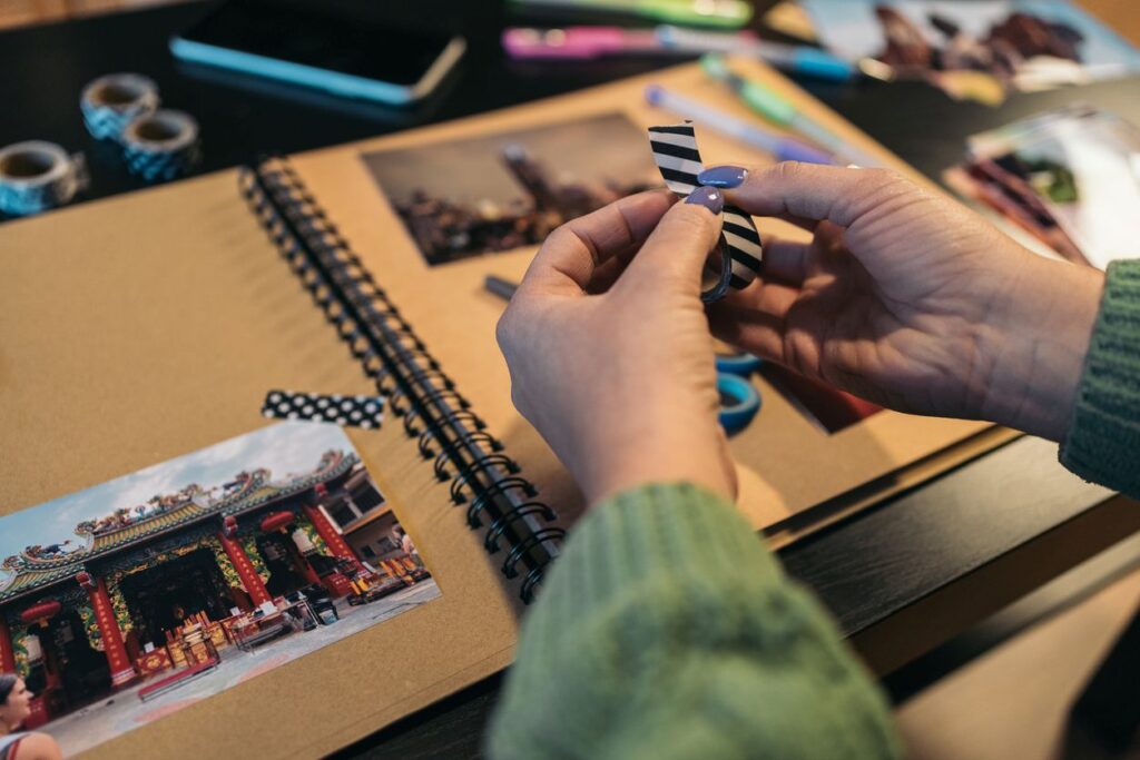 A woman scrapbooking